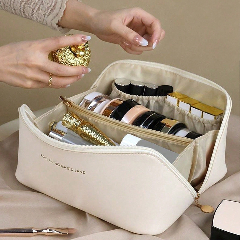 Customized fashionable pu pillow bags, portable travel storage bags, large-capacity toiletry bags, hand-enhanced appearance makeup bags details Picture