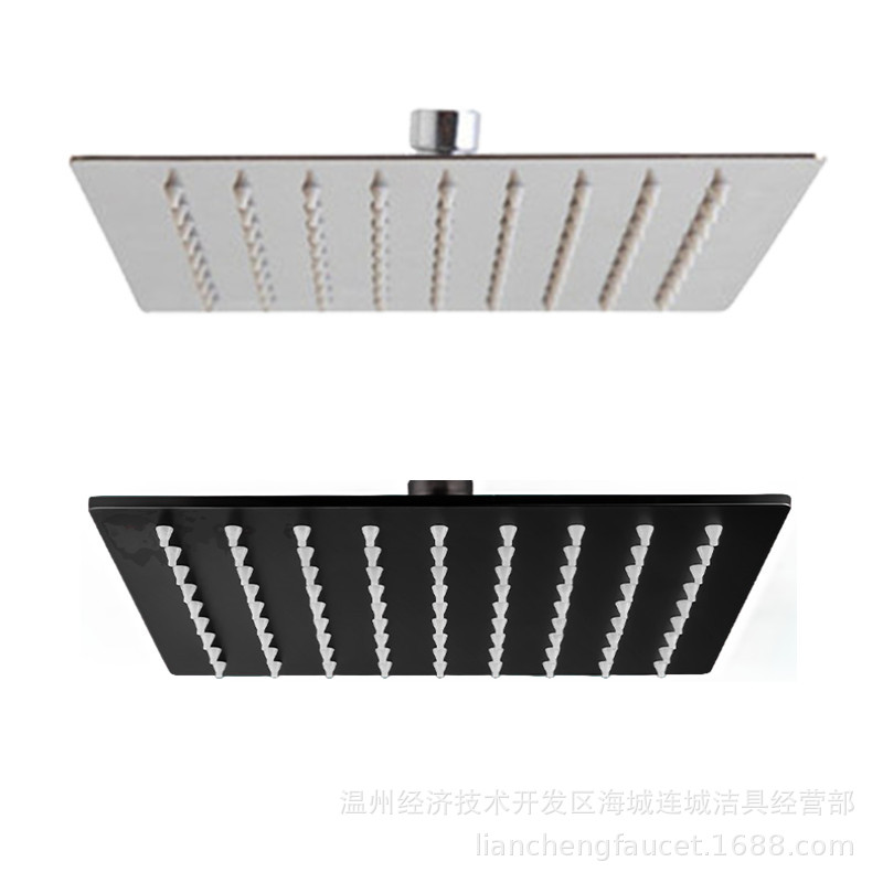 The stainless steel top shower head is black, gold and silver details Picture