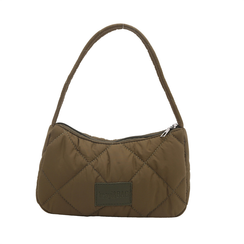 This year, large-capacity cotton-padded jackets for women are in vogue. The new 2024 fashionable canvas lightweight commuting single-shoulder dumpling bag for women is in vogue Item Picture