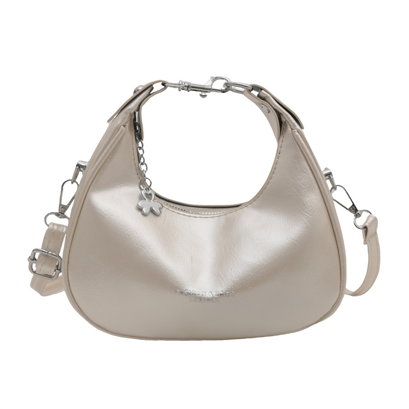 A niche Korean hand-held crescent moon bag for women, a new 2024 trendy and fashionable underarm bag, a versatile single-shoulder crossbody bag Item Picture