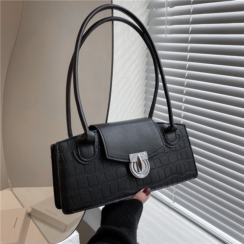 This is a trendy retro women's bag with a simple and mini square design. It's a stylish and trendy small bag that can be carried by hand or crossed full figure