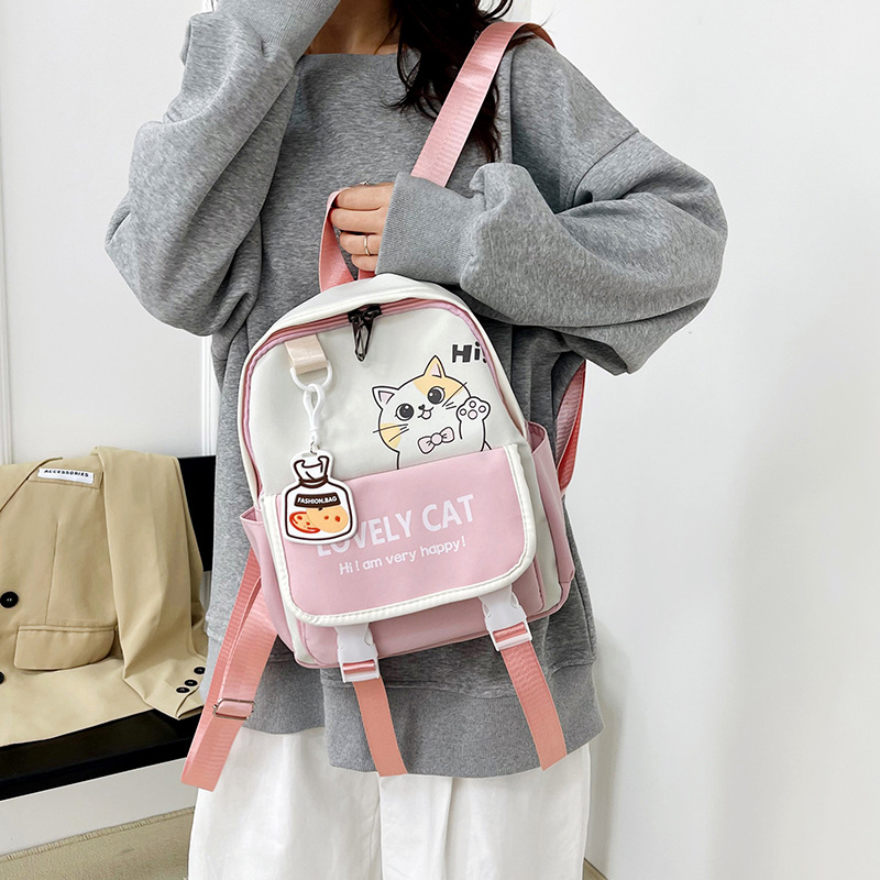 A lightweight and fresh college student casual backpack, a large-capacity, cute cat hand-held crossbody bag, and a cross-border trend details Picture
