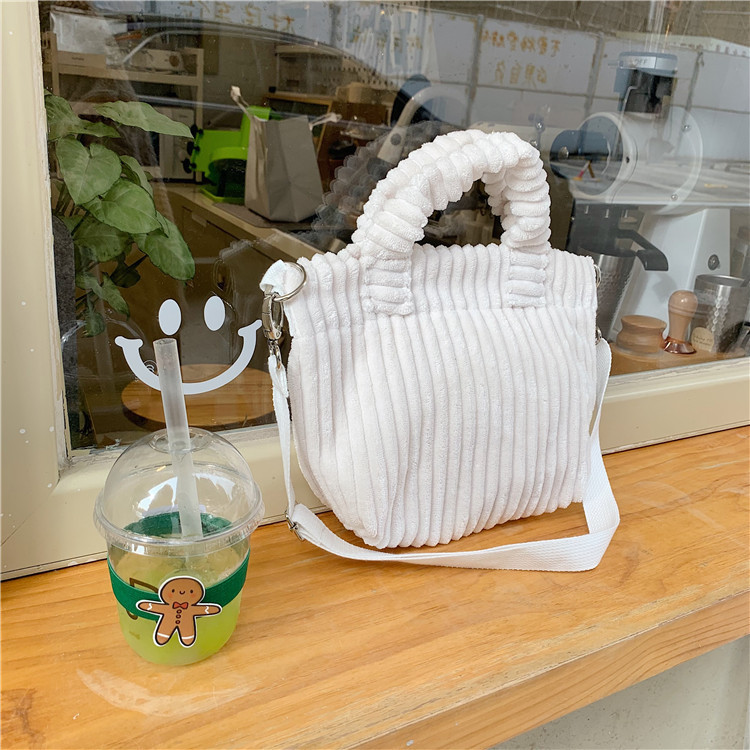 112272 Klein blue hand-held crossbody small bag corduroy Korean cute hand-held tote bag student trend Item Picture