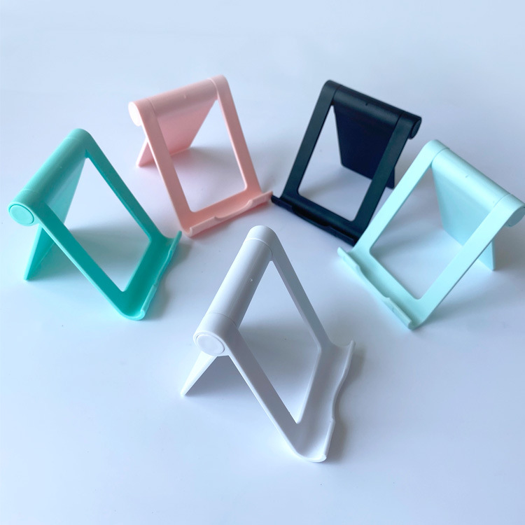 New desktop folding multi-functional stand for lazy people, suitable for mobile phones and tablets. 360° rotatable gift with LOGO printing function full figure