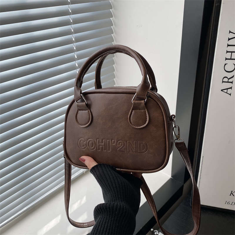 Korean niche hand-held bowling bag 2024 new style trendy bag, women's retro small square bag, versatile ins crossbody bag full figure