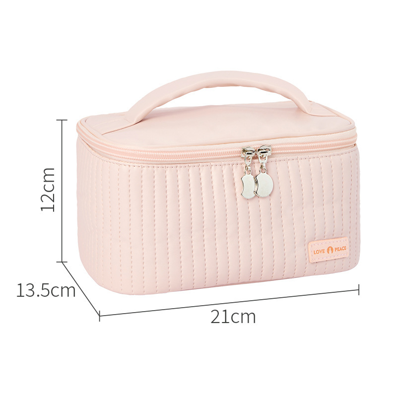 Open-lid portable and cute cake makeup bag, PU solid color hand-held toiletry bag, cosmetics storage bag, with a sense of luxury Application Scenario