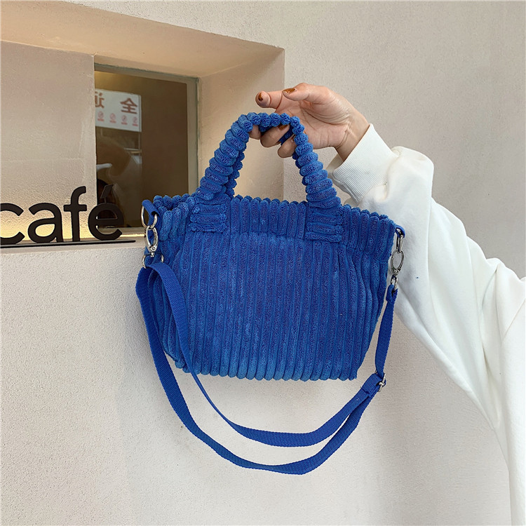 112272 Klein blue hand-held crossbody small bag corduroy Korean cute hand-held tote bag student trend Application Scenario