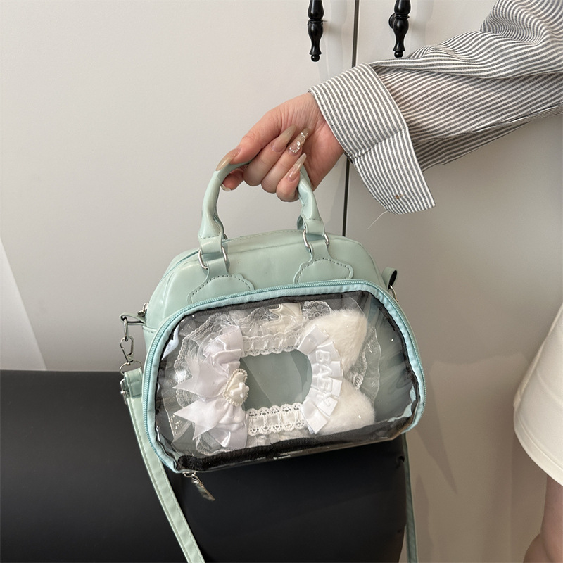 A Japanese-style comic pain bag for girls and students, a versatile single-shoulder, hand-held crossbody bag with a transparent shell texture full figure