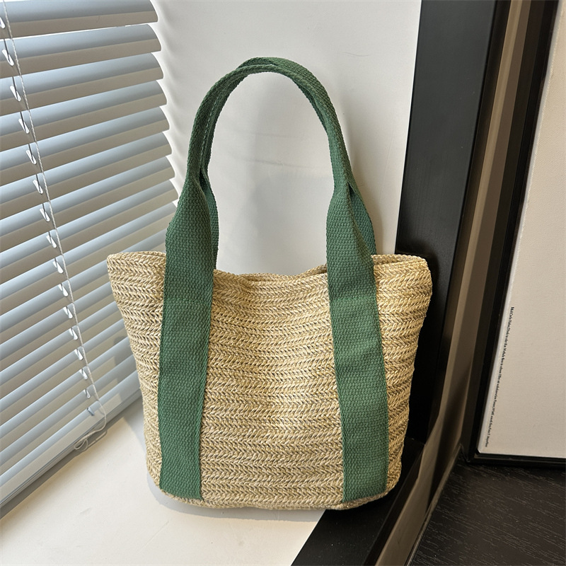 A niche fashion ethnic-style hand-held small bag for women in 2025, a new woven bag with a unique and high-end feel, and a crossbody bag full figure