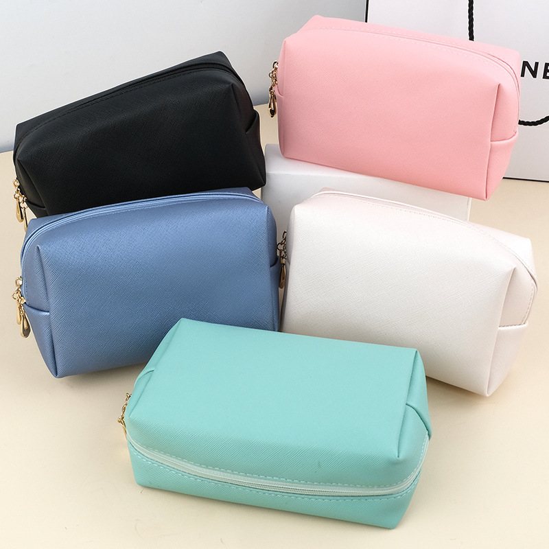 Wholesale of best-selling PU small-sized hand-held cosmetic bags, portable women's travel toiletry bags and cosmetic storage bags for foreign trade full figure