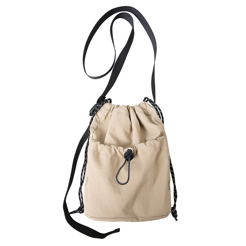 Summer men's and women's nylon crossbody bag, mini drawstring bucket bag, light and casual, ins style single-shoulder crossbody phone bag Item Picture