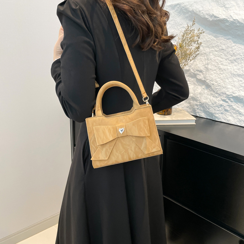 A cross-border high-end and fashionable women's handbag with a bow, a simple single-shoulder crossbody bag, and a versatile commuting bag for women details Picture
