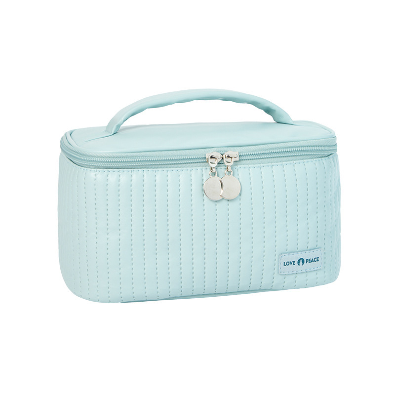 Open-lid portable and cute cake makeup bag, PU solid color hand-held toiletry bag, cosmetics storage bag, with a sense of luxury Item Picture