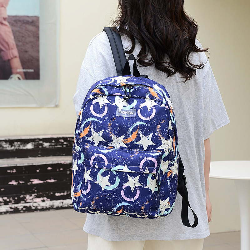A new large-capacity trendy backpack for girls in junior and senior high school campus style, a sweet and cute Korean version, and a lightweight hand-held crossbody bag full figure