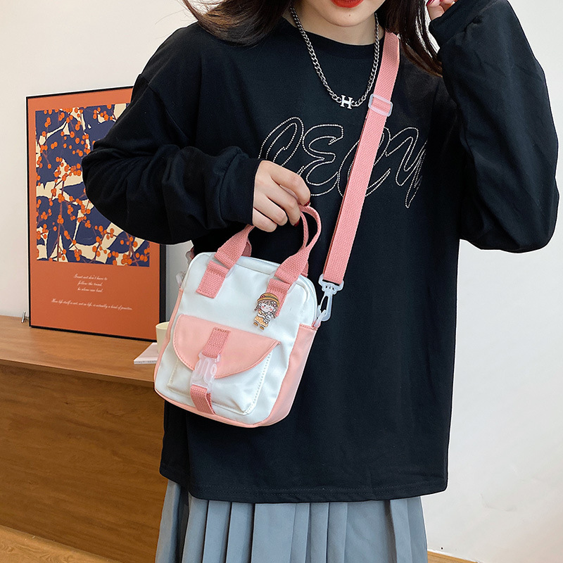 Korean style fashionable color-blocking hand-held small bag for women, 2021 new trendy single-shoulder crossbody women's bag, simple and individual small cloth bag details Picture
