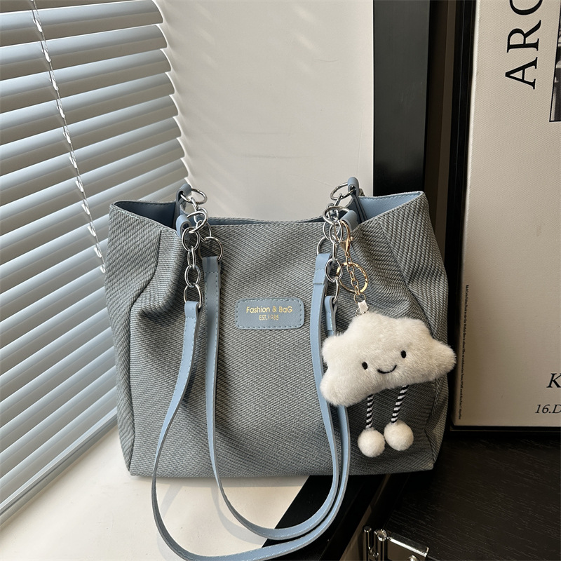 The 2025 new large-capacity student commuting bag, hand-held canvas tote bag, versatile, casual and artistic single-shoulder crossbody bag full figure