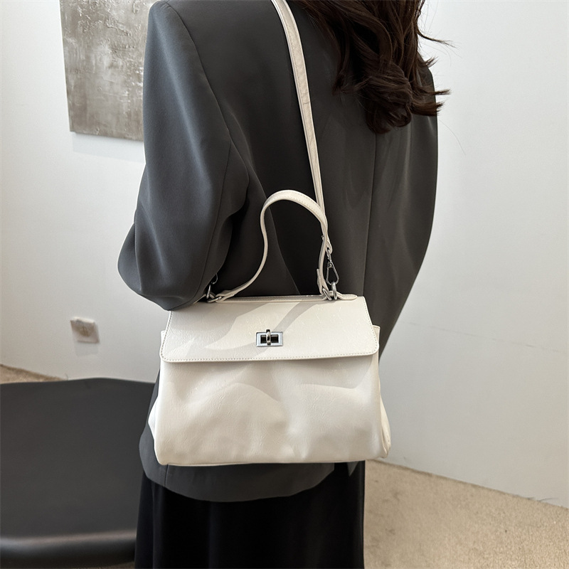 A new, stylish, laid-back and casual solid color 2024 retro and stylish large-capacity hand-held shoulder crossbody women's bag details Picture