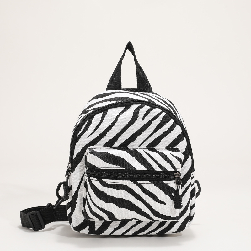 This mini canvas backpack is super popular on Instagram. It's a cute commuting makeup bag with cow texture. It's a versatile student bag Item Picture