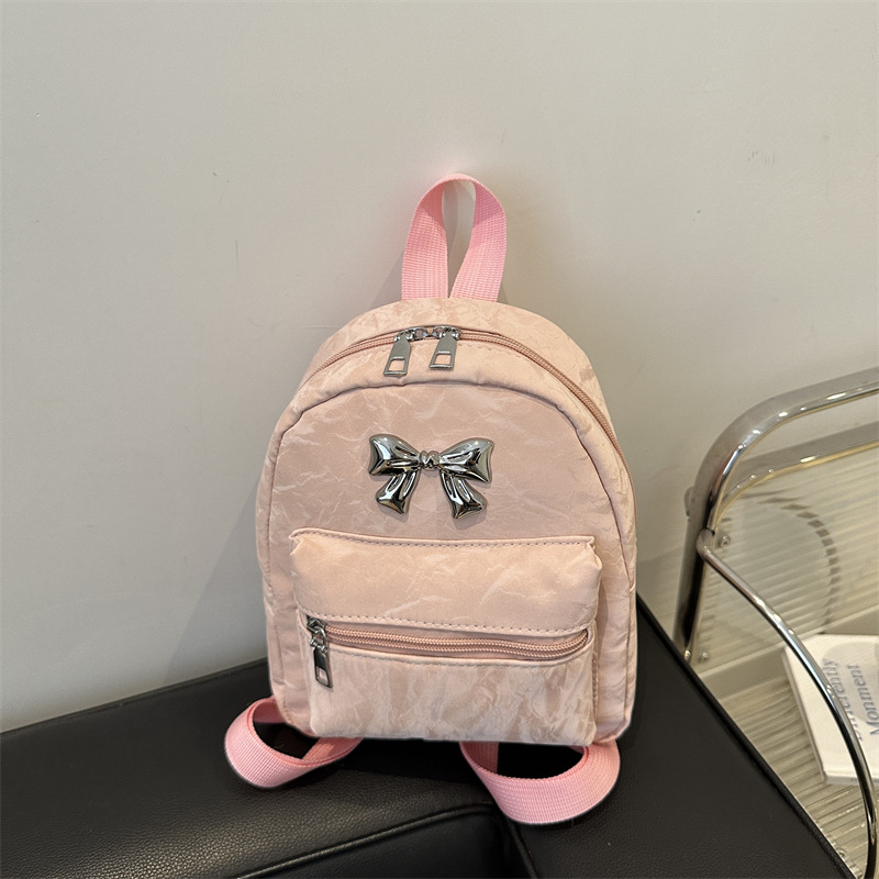 Bow backpack for women, a niche, casual and fashionable Korean girl bucket bag, a lightweight and small hand-held shoulder bag full figure