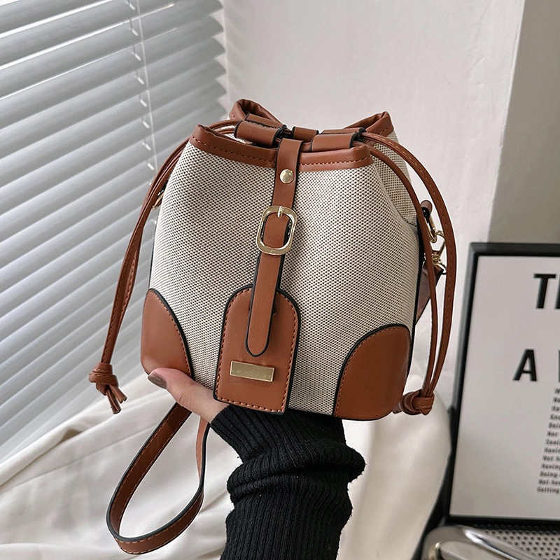 Cross-border foreign trade women's 2023 new Korean-style canvas patchwork color-blocking drawstring bucket bag with fashionable and niche design details Picture