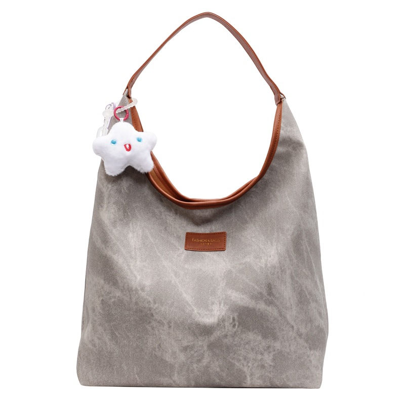 The new 2024 winter stylish and versatile Tote bag is a large-capacity brown single-shoulder bucket bag with a patchwork design for daily travel Item Picture