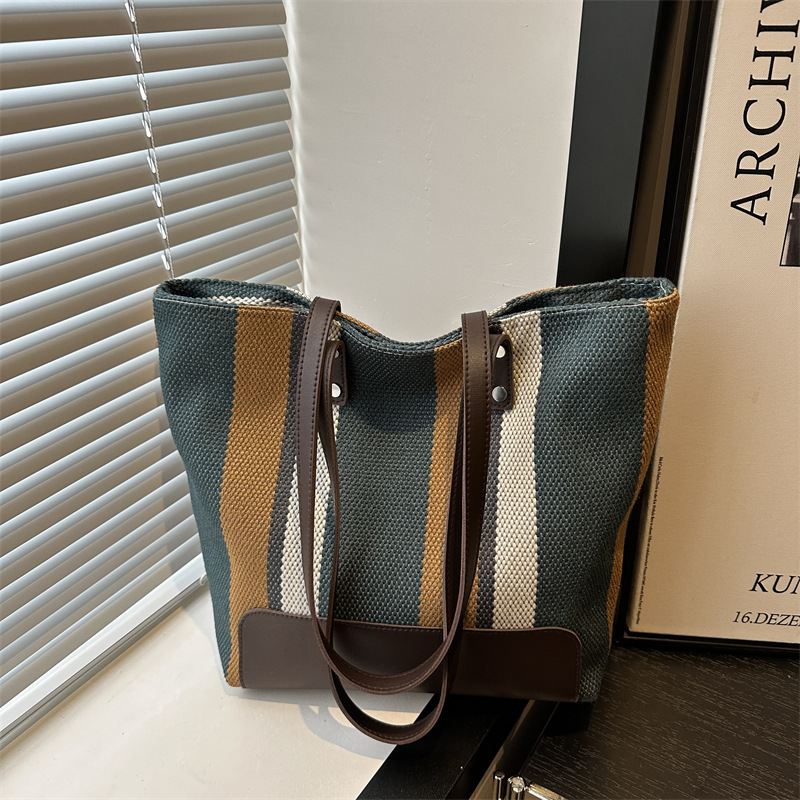 Stylish and high-quality women's bag 2024 New style, color-blocking striped canvas commuter tote bag, trendy single-shoulder bag full figure