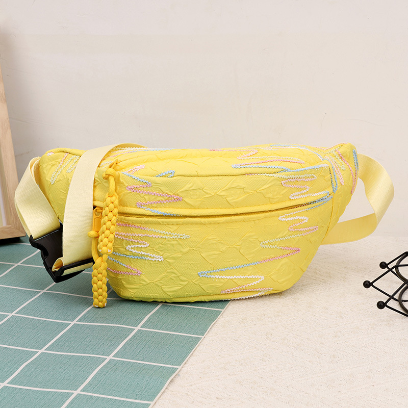 A stylish girl's small backpack with Korean InS-style rhythmic striped embroidered tassel crossbody bag, casual and versatile dumpling bag full figure