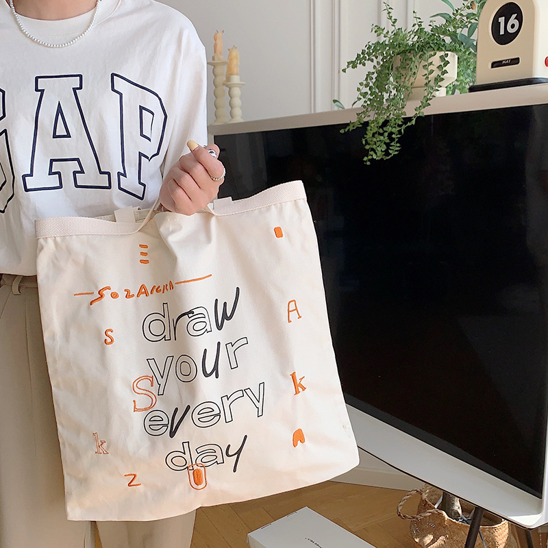 35242 Korean-style Instagram graffiti letter printed canvas bag, new women's hand-held tote bag, college student single-shoulder bag full figure
