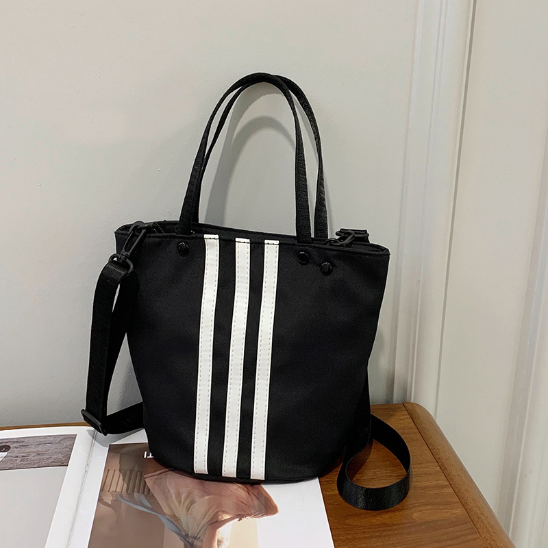 2025 New niche three-bar handbag, large-capacity single-shoulder bag, casual and versatile bucket Oxford cloth crossbody bag full figure