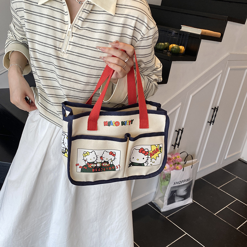 Canvas bag for girls 2024, high appearance level, cartoon hand-held bag, bento bag, large capacity, multi-functional mommy handbag for going out details Picture