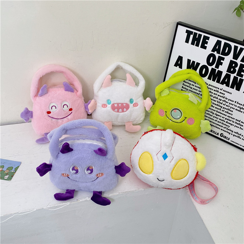 Autumn and winter fashion plush cartoon hand-held little monster three-eyed boy flip bag, large-capacity double-sided women's bag storage bag full figure