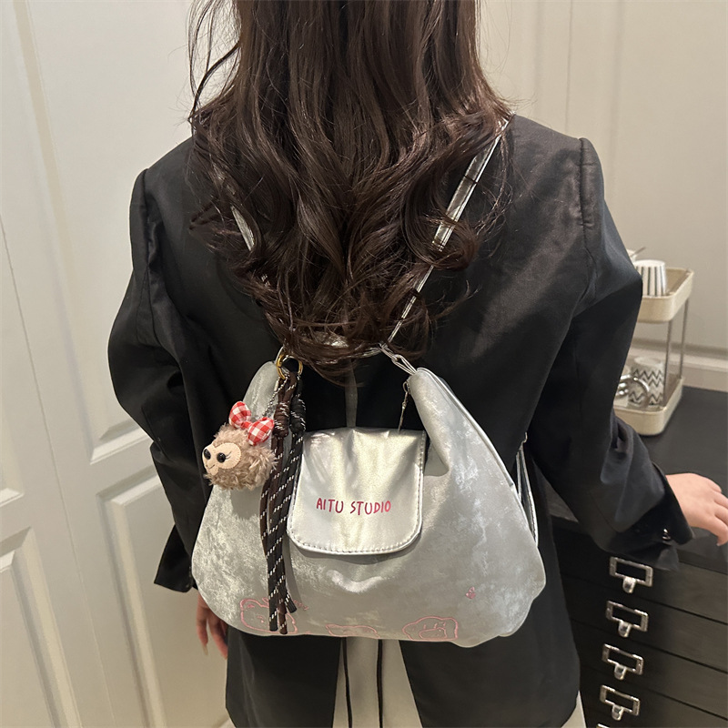 The 2025 new style of the Textured Women's bag is a fashionable and versatile commuting backpack with a trendy, textured and niche design. It features a single-shoulder tote bag details Picture