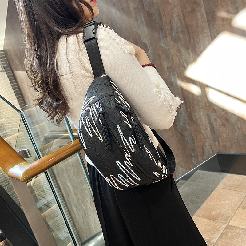 A stylish girl's small backpack with Korean InS-style rhythmic striped embroidered tassel crossbody bag, casual and versatile dumpling bag details Picture