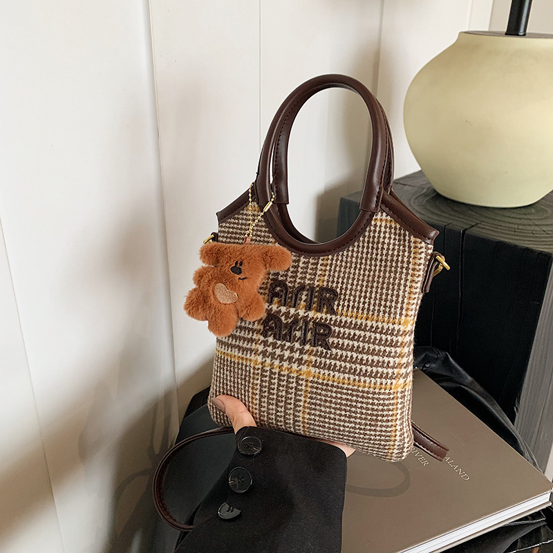 A trendy and stylish leopard print retro hand-held loose change bag for women, a versatile and stylish casual commuting crossbody bag full figure