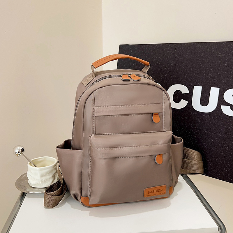 2025 New European and American retro college student canvas bag, large-capacity backpack, fashionable and versatile commuting crossbody bag full figure