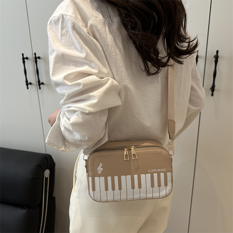 The new spring 2025 fashion color-blocking small square crossbody bag is a sweet and unique piano note single-shoulder bag for girls details Picture