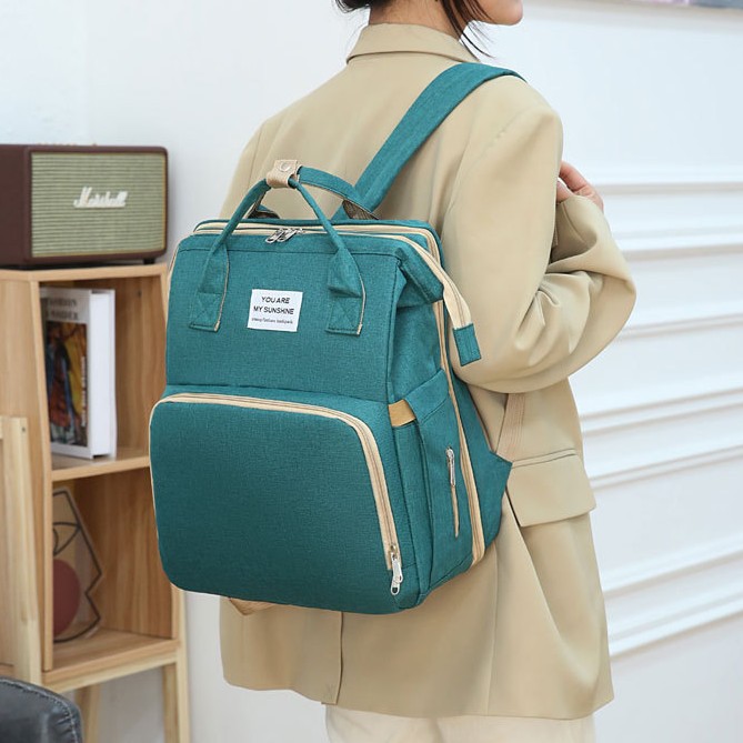Cross-border exclusive folding mommy bags, travel bags, hand-held crib bags, large-capacity multi-purpose mother and baby backpacks Application Scenario