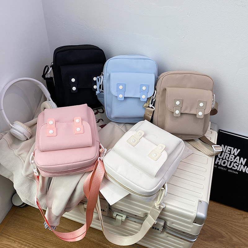 The new solid-color small cloth bags for autumn are cute and simple. Travel bags, student single-shoulder bags, mobile phone bags, small crossbody bags and crossbody bags full figure
