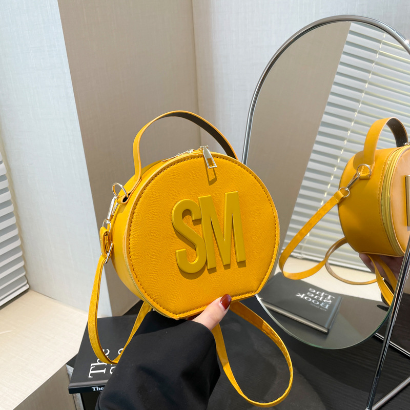 A new Korean-style small round letter handbag for spring 2025, a single-shoulder crossbody bag for cross-border trendy women full figure
