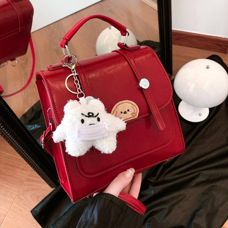 The new red versatile small bag for women's backpacks in the autumn of 2024 features a unique design that is stylish and fashionable for commuting full figure