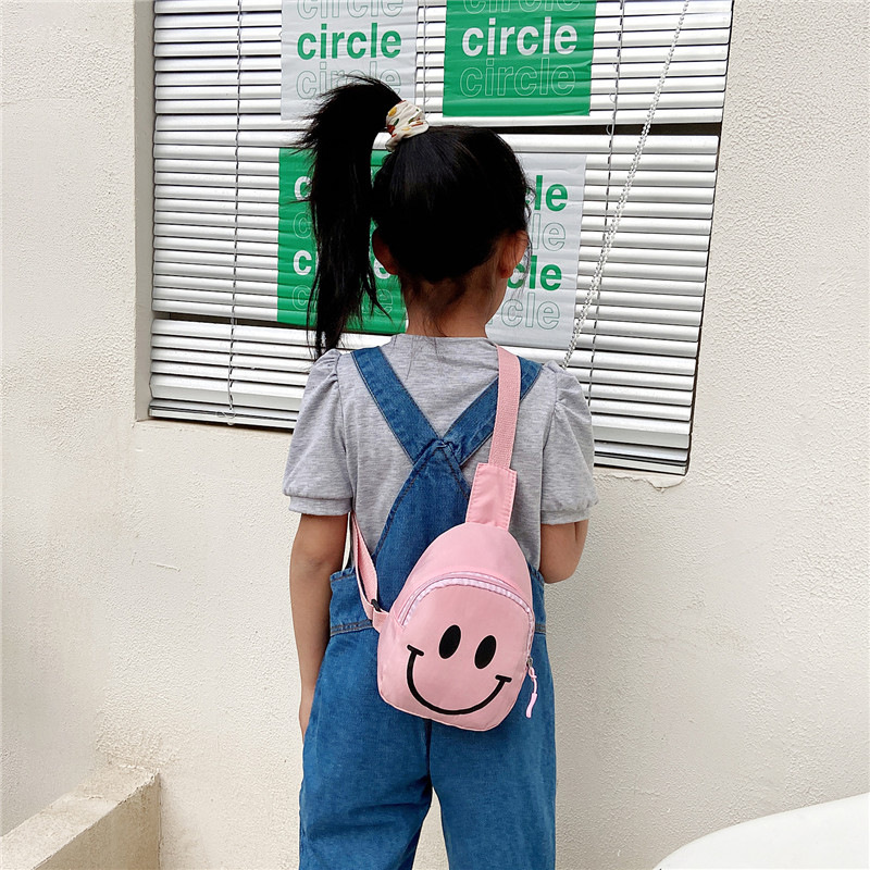 Cute children's waist bag, Korean-style smiling face, trendy and fashionable chest bag, crossbody bag, trendy cartoon coin purse for boys and girls Application Scenario