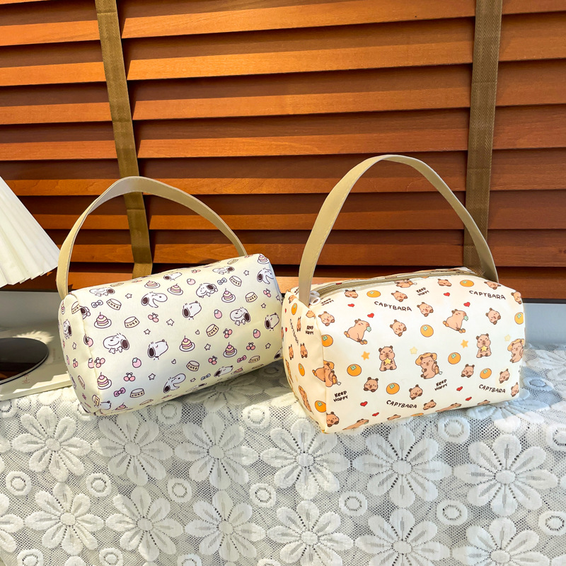 New cartoon portable makeup handbag, high appearance level travel bento bag, large capacity, super cute three-dimensional storage bag full figure
