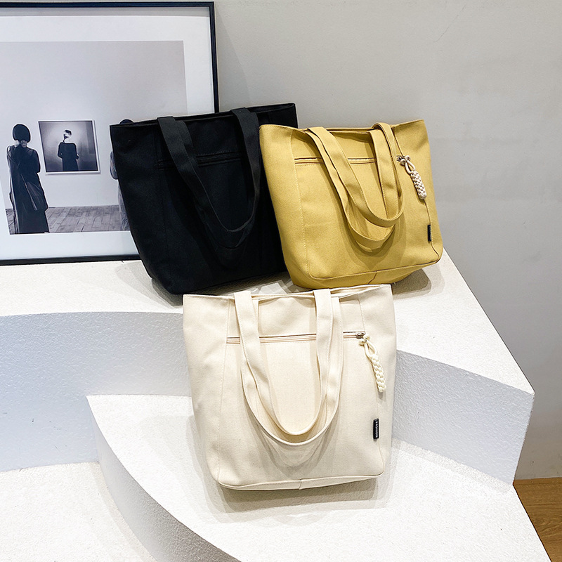 Solid color simple single-shoulder bag, 2024 new large-capacity fashionable lightweight tote bag, niche popular and beautiful canvas bag full figure
