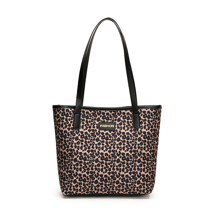This year, the 2024 new large-capacity school commuting bag, the leopard print bag, and the stylish single-shoulder tote bag with a patchwork design are all the rage for women Item Picture