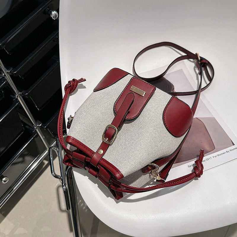 Cross-border foreign trade women's 2023 new Korean-style canvas patchwork color-blocking drawstring bucket bag with fashionable and niche design Specification drawing