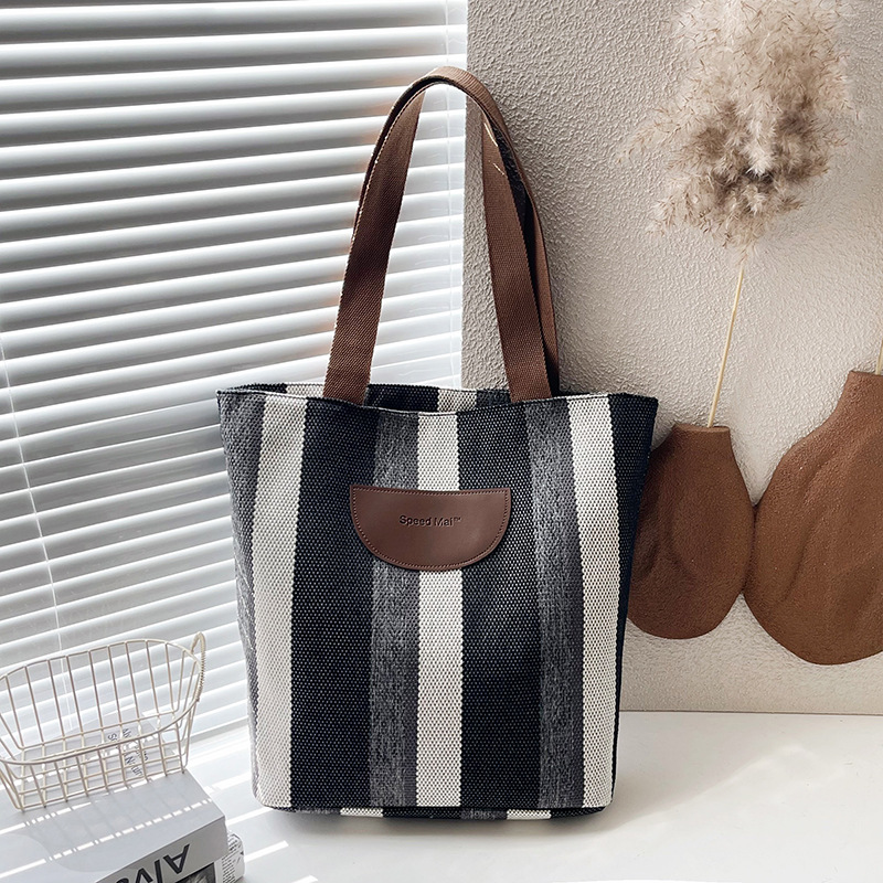 Cross-border fashion striped printed bucket cloth bag 2025 New style color-blocking versatile hand-held cloth pocket single-shoulder bag full figure