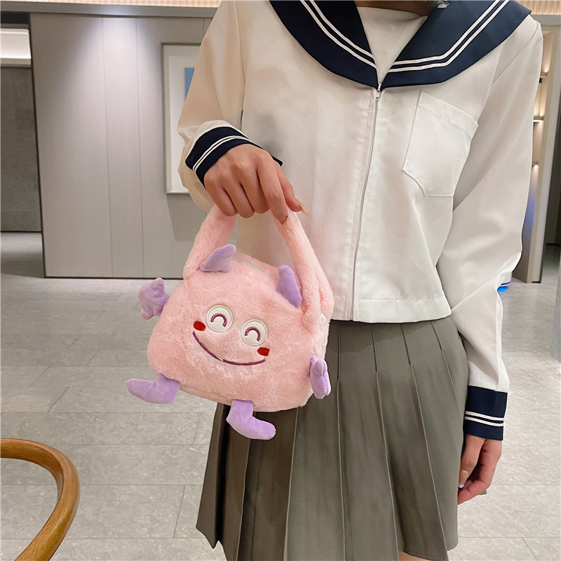 Autumn and winter fashion plush cartoon hand-held little monster three-eyed boy flip bag, large-capacity double-sided women's bag storage bag Specification drawing
