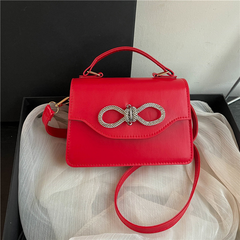 A stylish Korean-style simple solid color bow with stitching, casual and casual, crossbody single-shoulder hand-held small square women's bag full figure