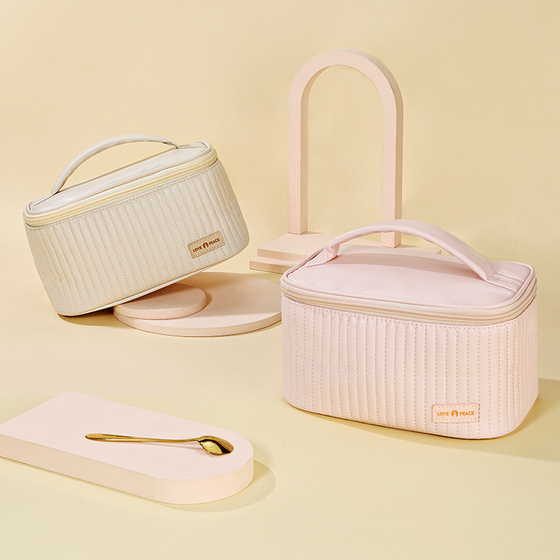 Open-lid portable and cute cake makeup bag, PU solid color hand-held toiletry bag, cosmetics storage bag, with a sense of luxury Specification drawing