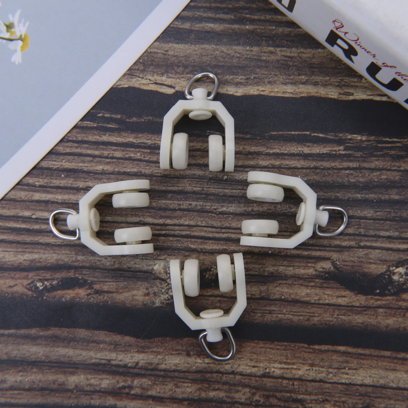 The manufacturer supplies silent metal curved rail wheels, sliding wheels, stainless steel curtain track accessories, and curved wheels in curtain tracks details Picture